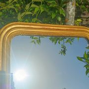 Miroir Louis-Philippe ancien doré patiné
