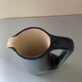 Sleek shaped pitcher in blue shaded ceramic. Signed under the base Stocker Fred and Andrée