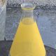 Liqueur service composed of a glass carafe and 8 small yellow screen-printed glasses