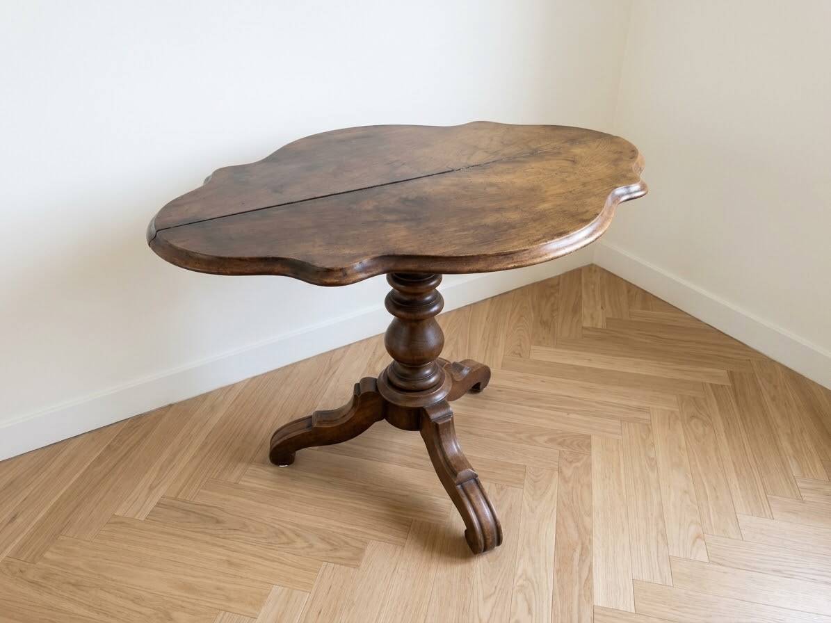 Antique wooden gueridon with a scalloped top.