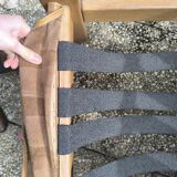 Pair of solid wood and leather lounge chairs, European work, circa 1970.