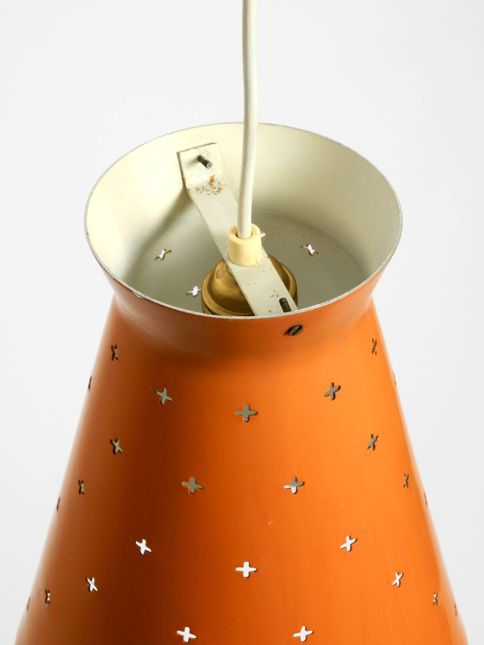 Beautiful Mid Century Modern Diabolo perforated metal sheet pendant lamp