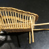 Fun wicker basket, late nineteenth, in the shape of a wheelbarrow.
