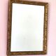 Miroir rectangulaire Art déco, cadre doré et travaillé