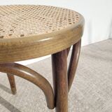 Low stool in cane and curved wood