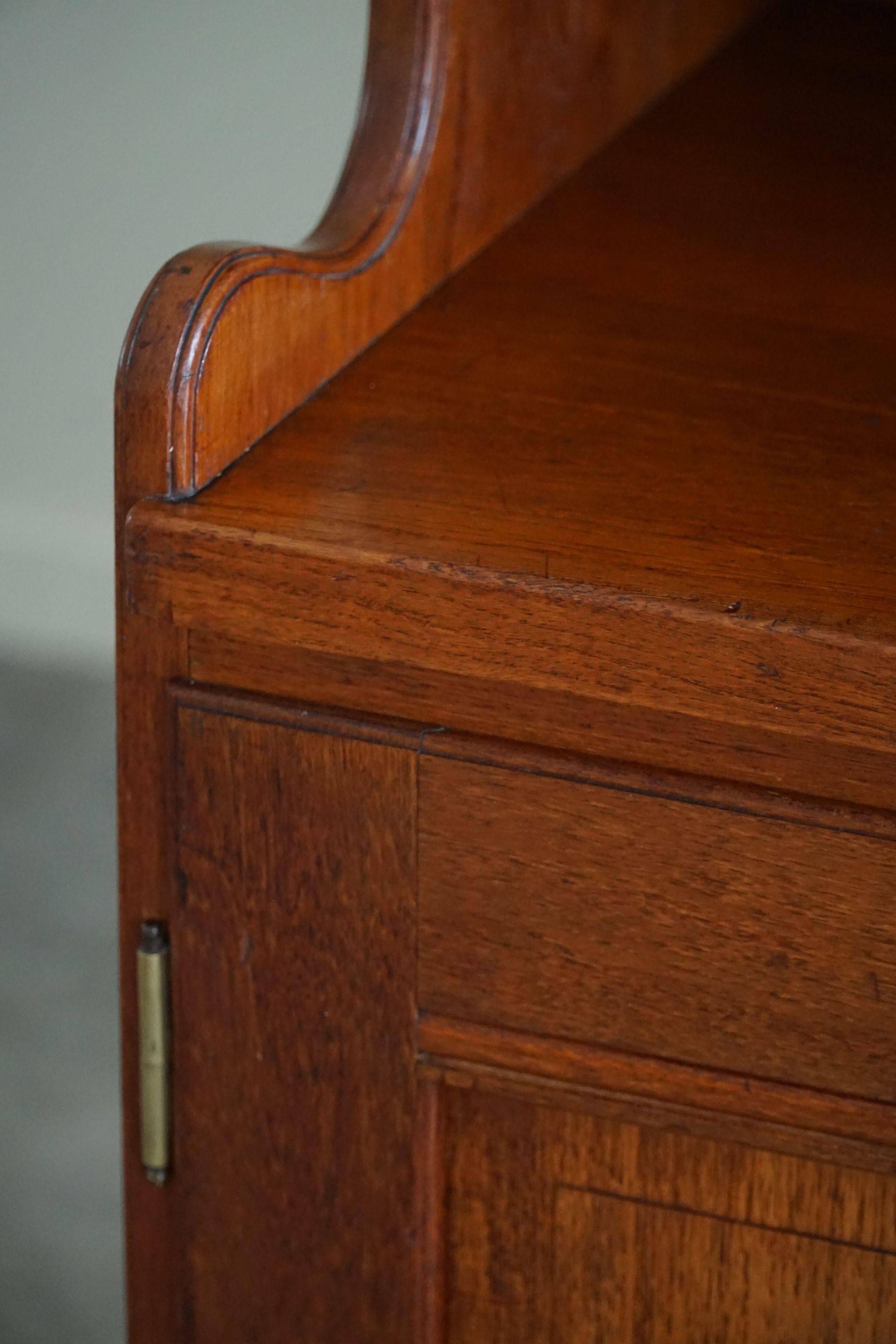 Rare high cabinet in teak by Martin Nyrop for Rud. Rasmussen, Denmark, early 20th century.