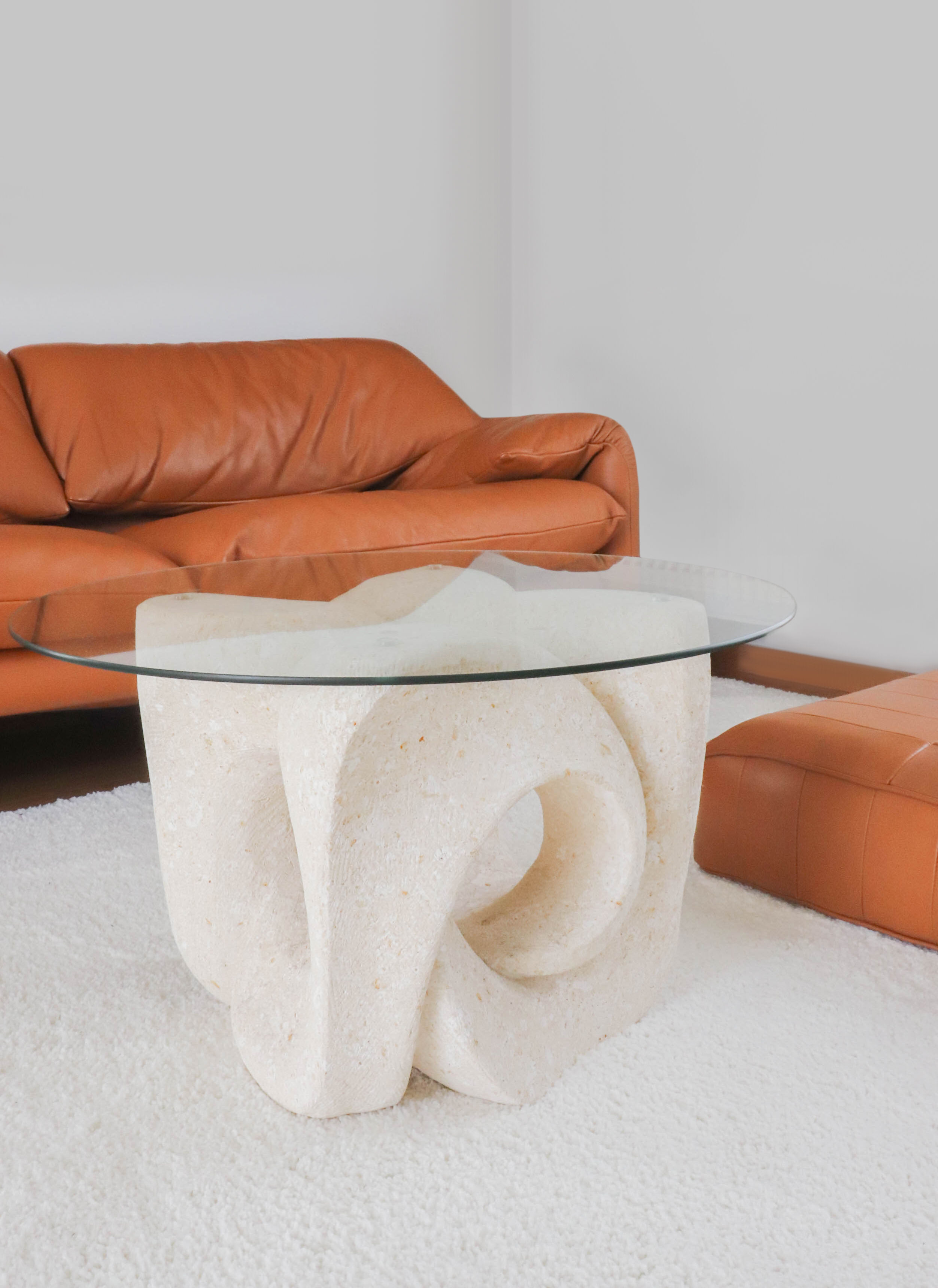 A Vintage White Stone Coffee Table with Glass Table Top