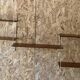 Vintage modular wall shelf with 4 supports and 5 levels.