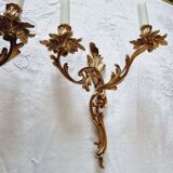 Pair of vintage French wall sconces in bronze, Louis XV Rococo style.