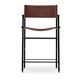 By contemporary classic bar stool with cognac leather backrest, black rubber, metal.