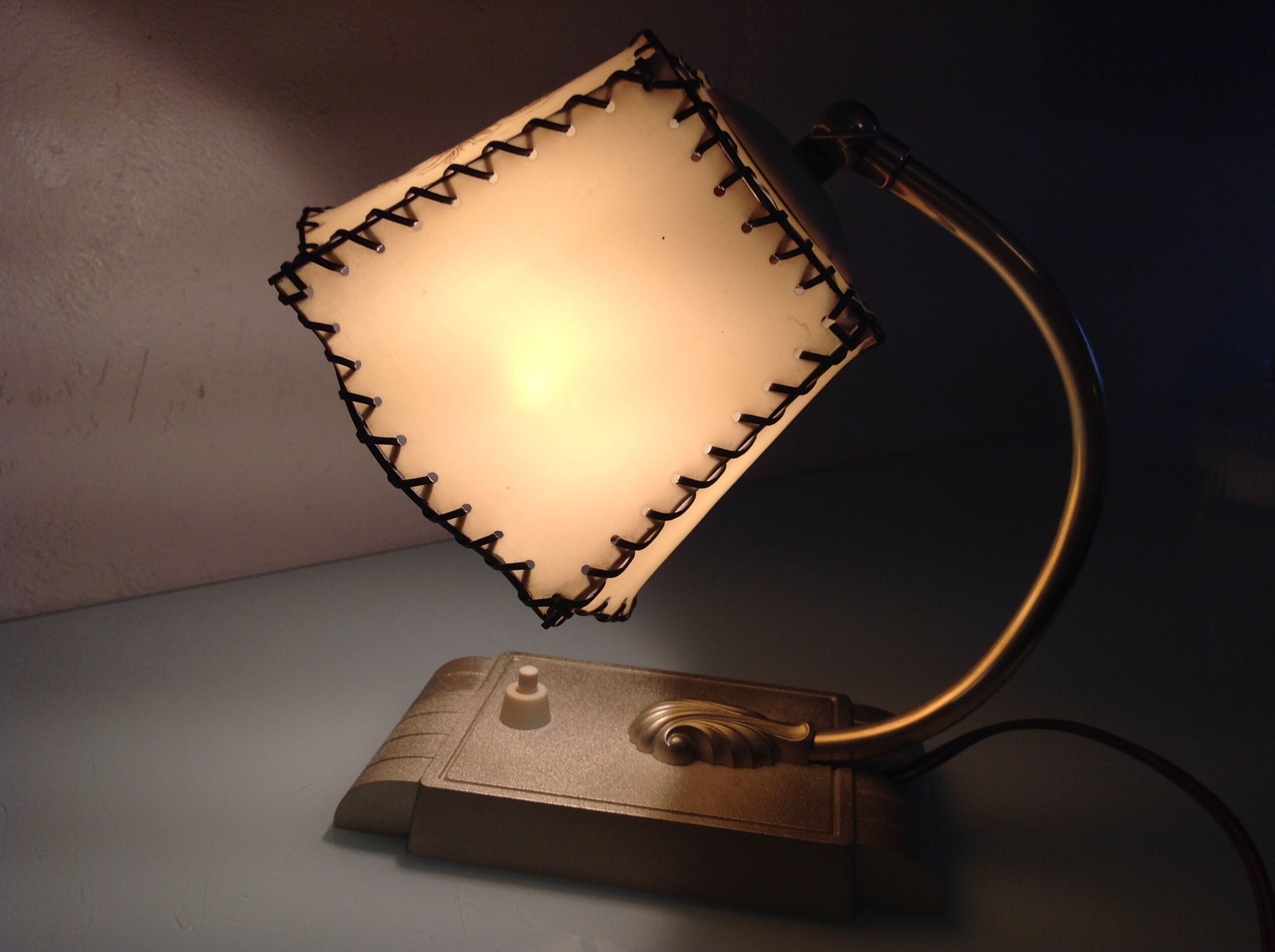 Brass bedside lamp and beige lampshade art deco style