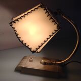 Brass bedside lamp and beige lampshade art deco style