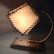 Brass bedside lamp and beige lampshade art deco style