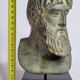 Bust of Poseidon in patinated plaster on wooden base