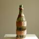 Glass bottle covered with wicker, France of the 60