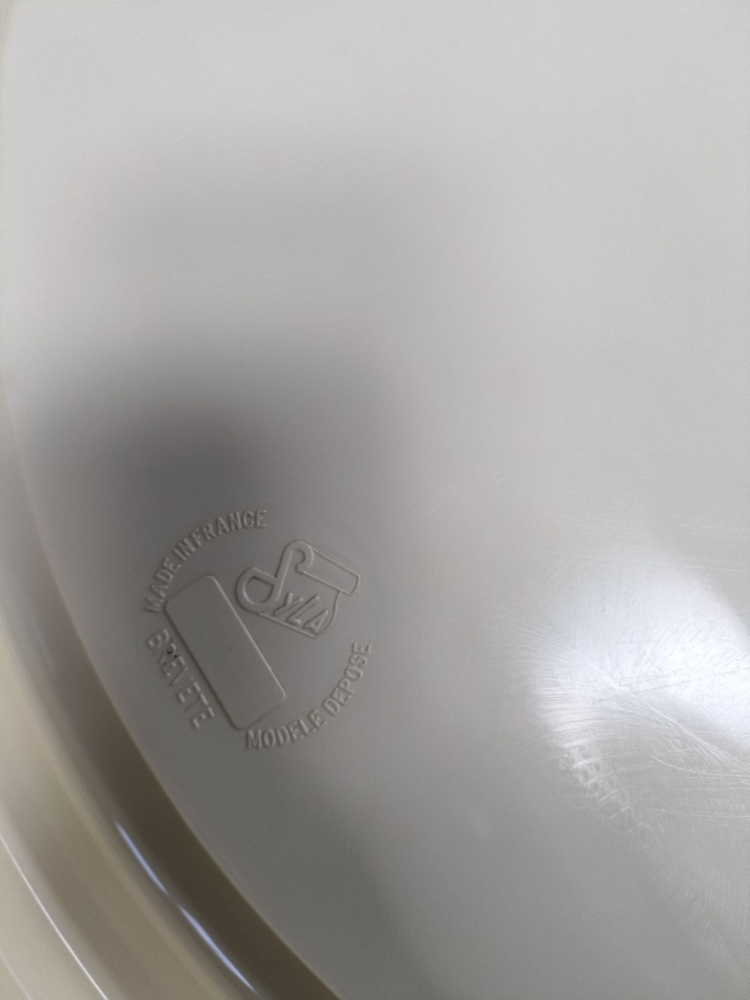 Round mirror in cream plastic, French house Syla, 70s