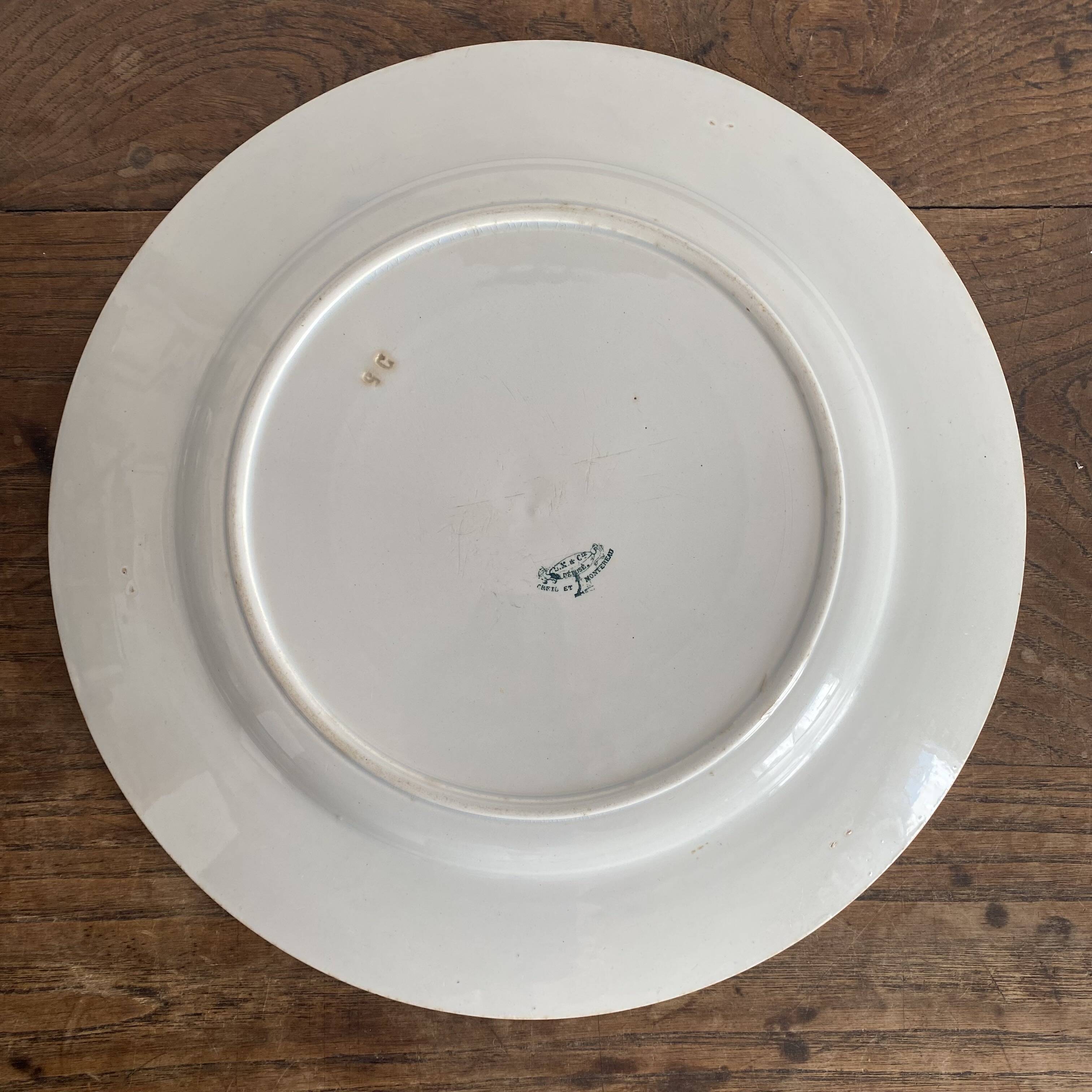 Set of large round white earthenware dishes from Creil and Montereau, 19th century