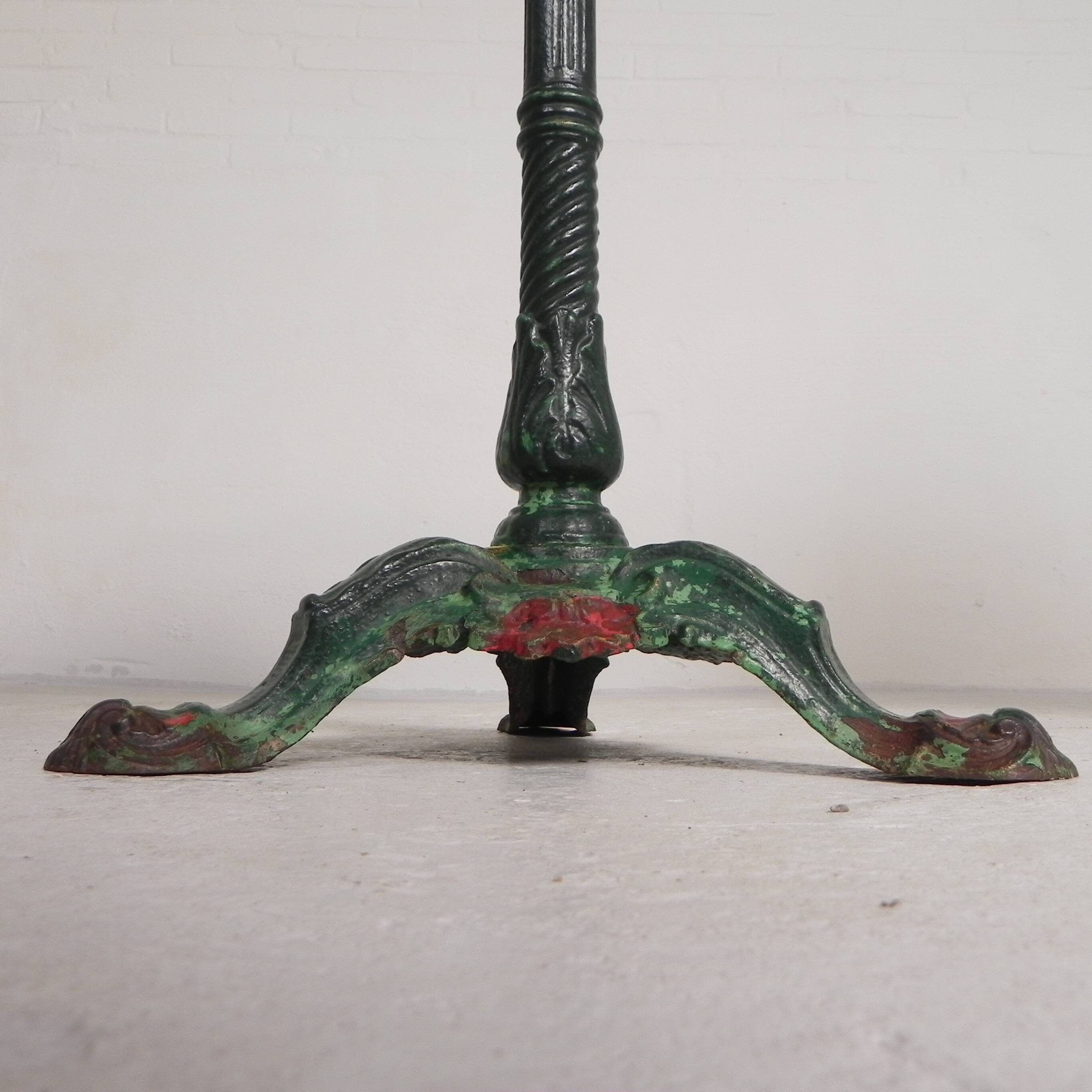 Bistro table with cast iron legs and marble top, 1920s.