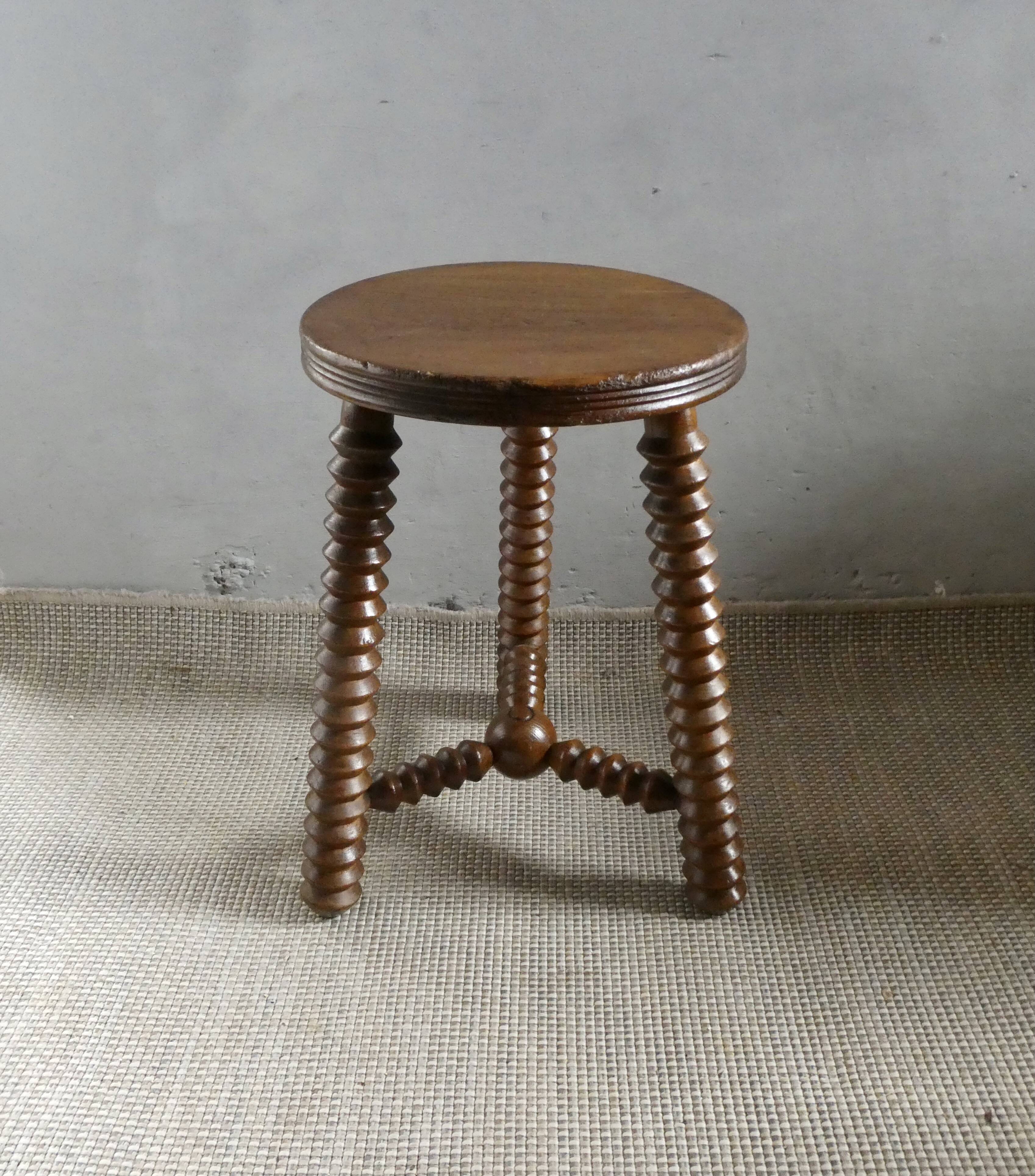 Tripod stool, with carved legs, around 1940