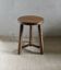 Tripod stool, with carved legs, around 1940