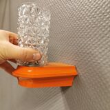 Bathroom lamps in a nice orange colour with a crystal glass shade and a base of hard thin plastic
