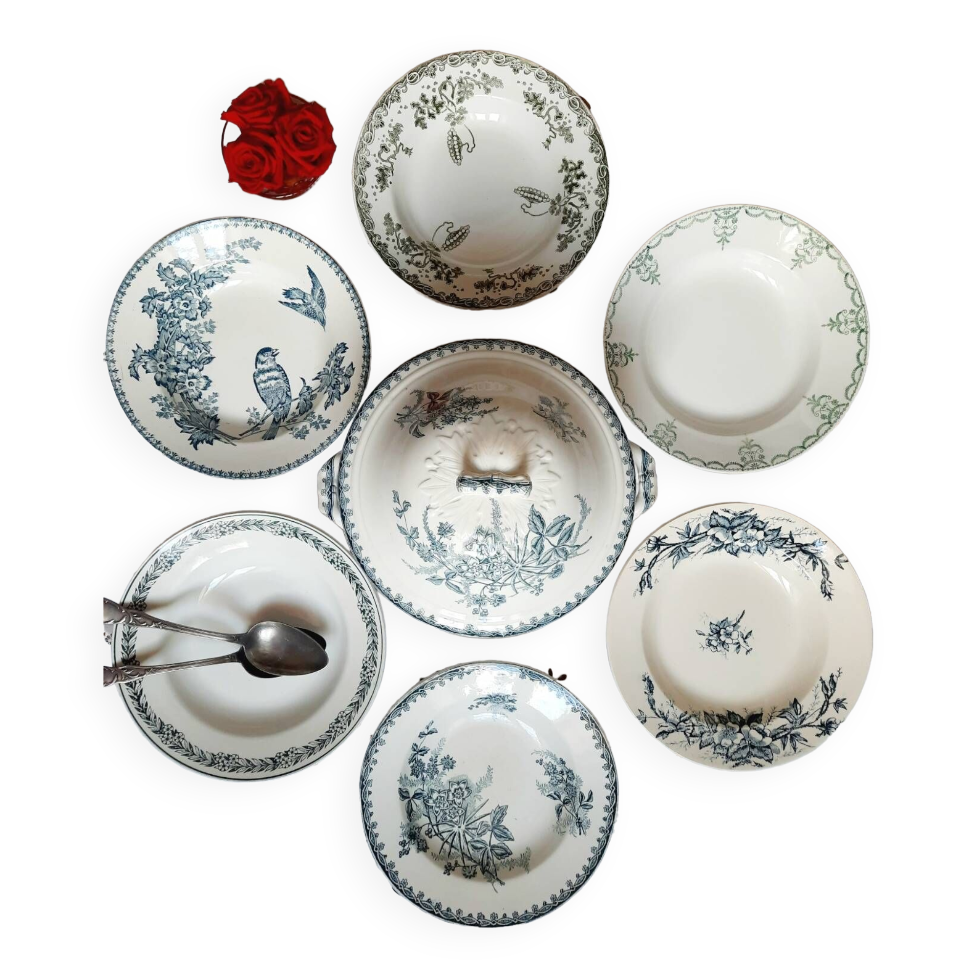 Old mismatched hollow plates in iron earth earthenware accompanied by a soup tureen