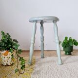 Antique tripod stool made of solid wood in blue.
