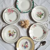 Old hollow plates mismatched in earthenware with gilded edges