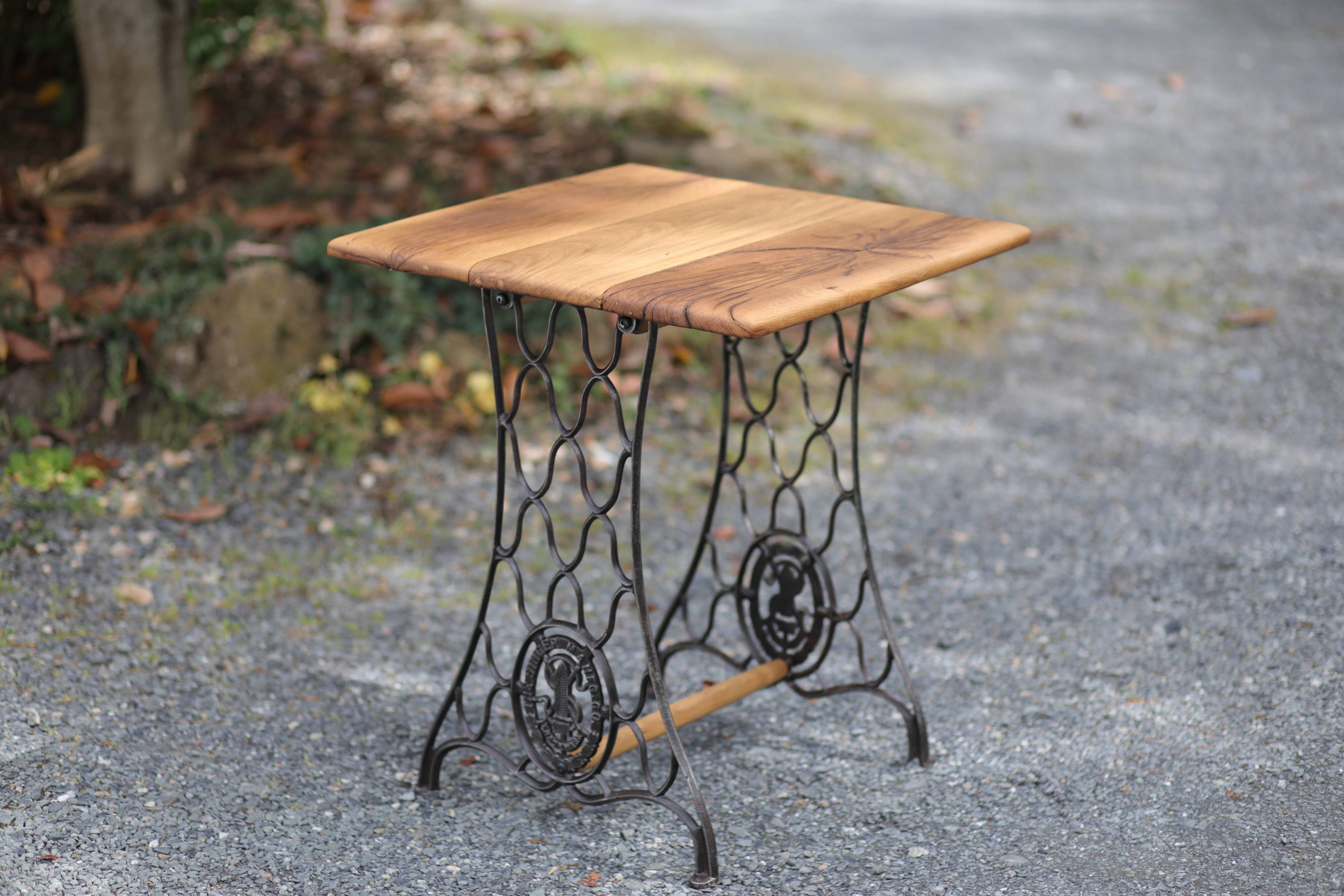 Old industrial table with sewing machine base – solid wood