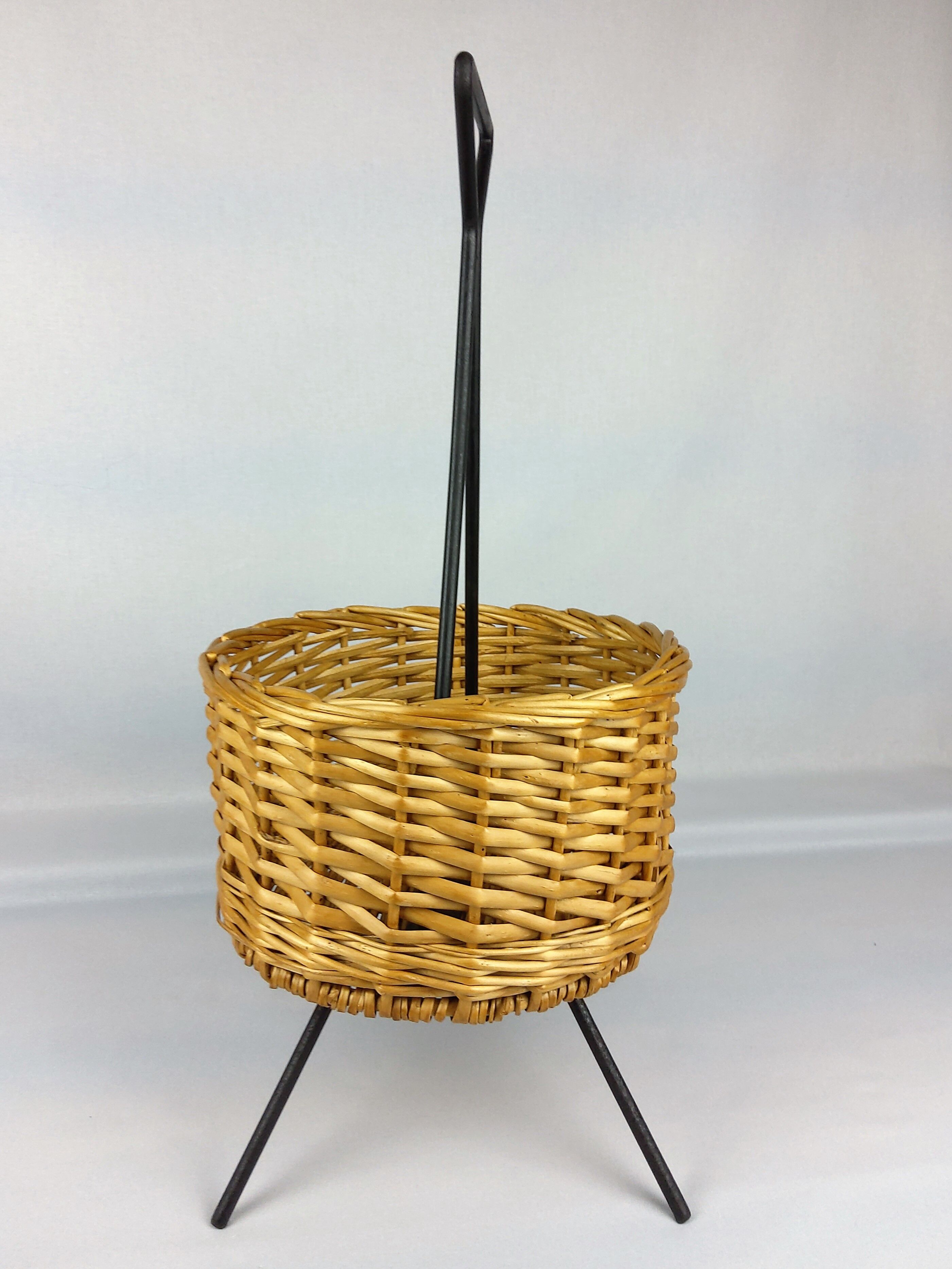 Black metal rattan trash can on 1960