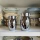 2 Hermès insulated jugs in chrome metal and covered leather.