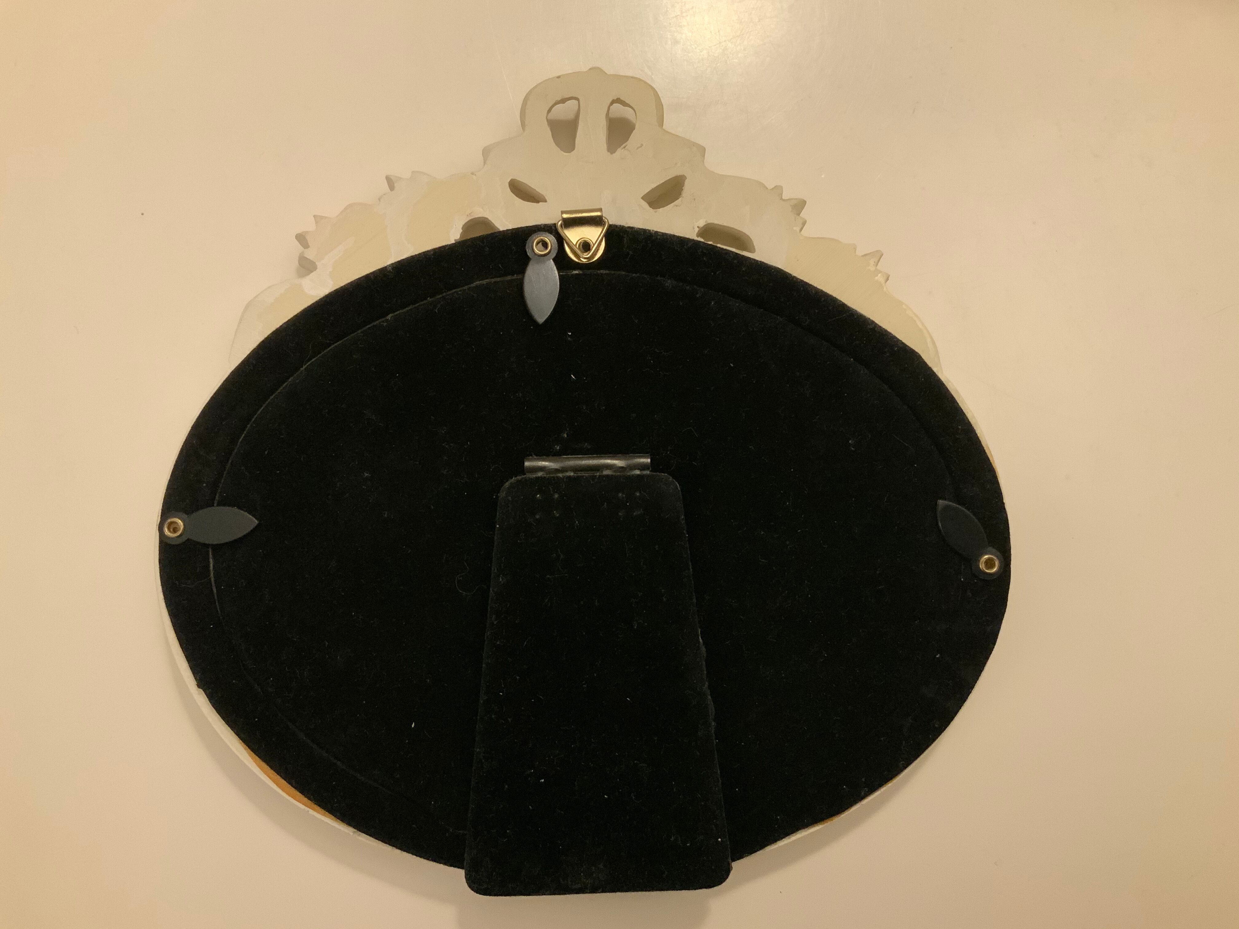 2 off-white oval plaster frames