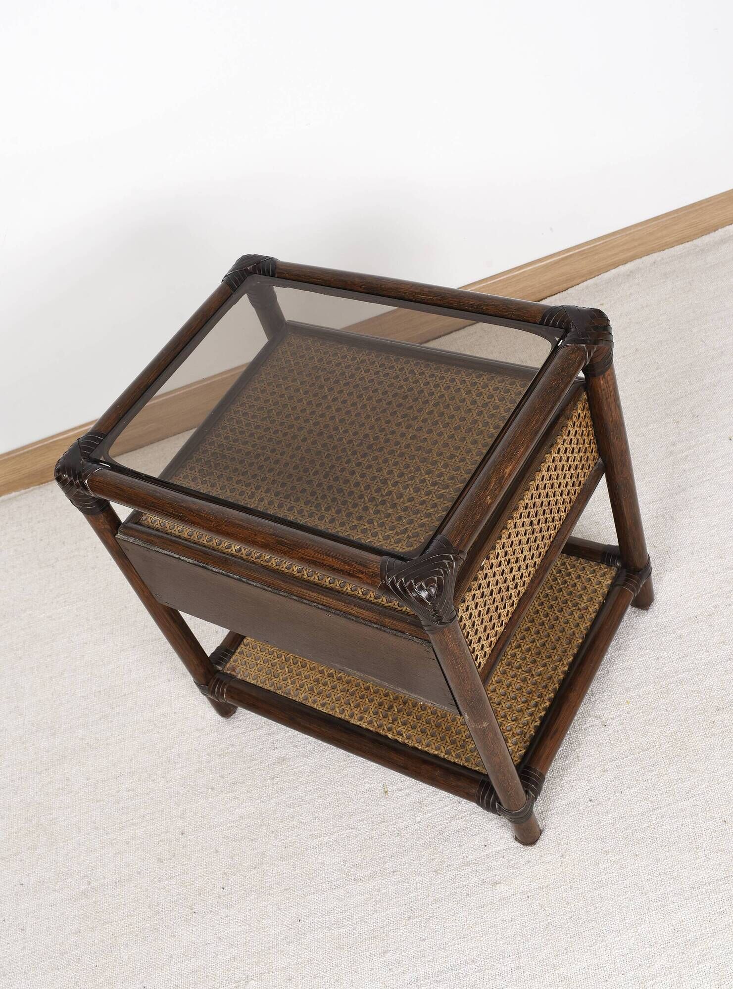 Rattan and cane bedside table, smoked glass top
