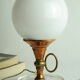Vintage globe lamp in glass, copper, and brass.