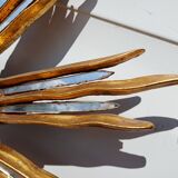 2 wooden sun mirrors and golden plaster