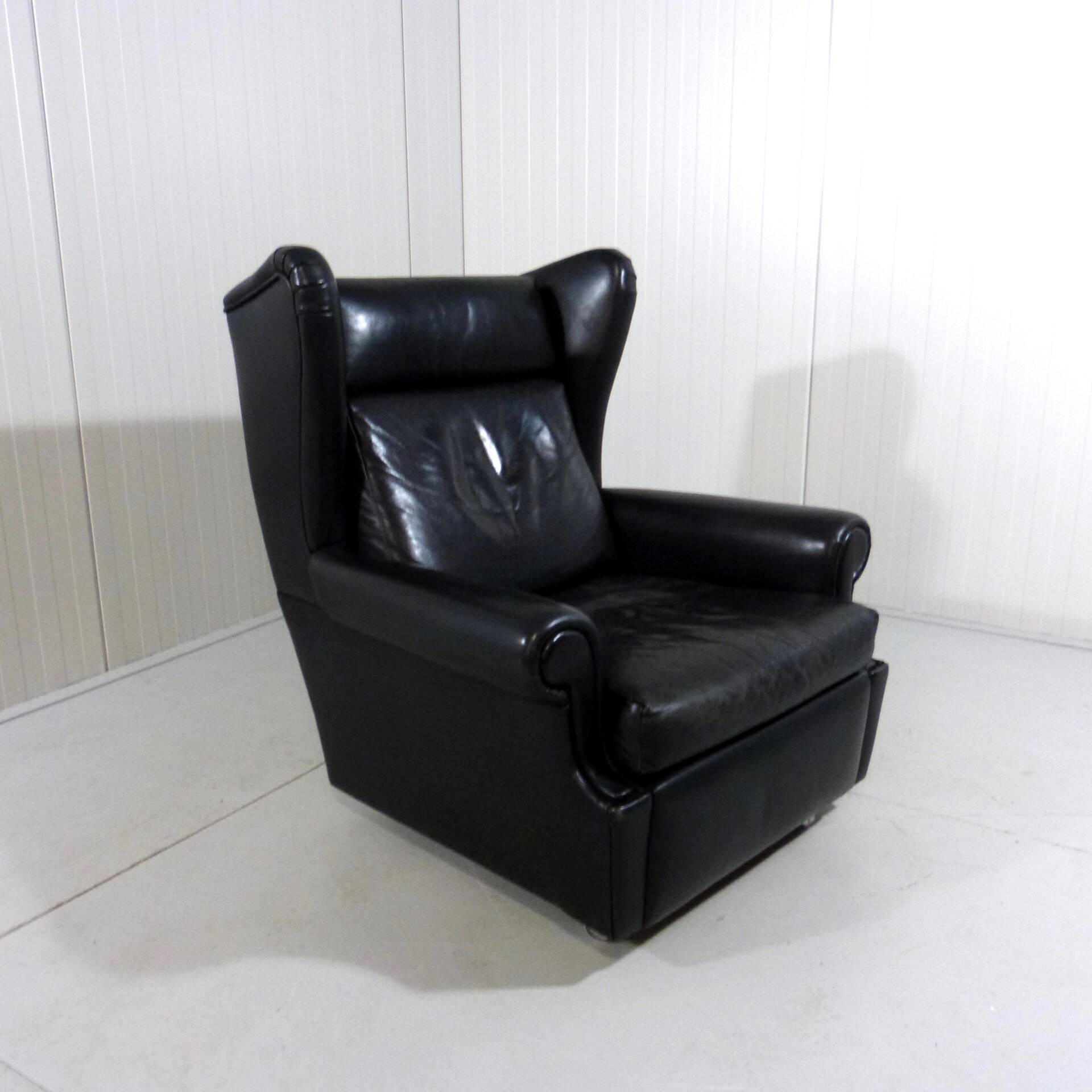 Black leather wingback chair on wheels 1960’s