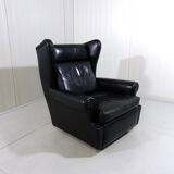 Black leather wingback chair on wheels 1960’s