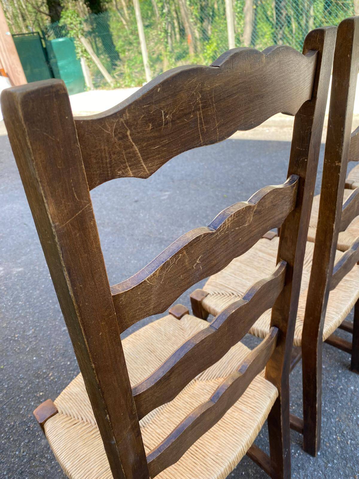 4 or 5 solid wood chairs with light oak straw and high backs