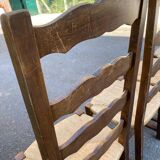 4 or 5 solid wood chairs with light oak straw and high backs
