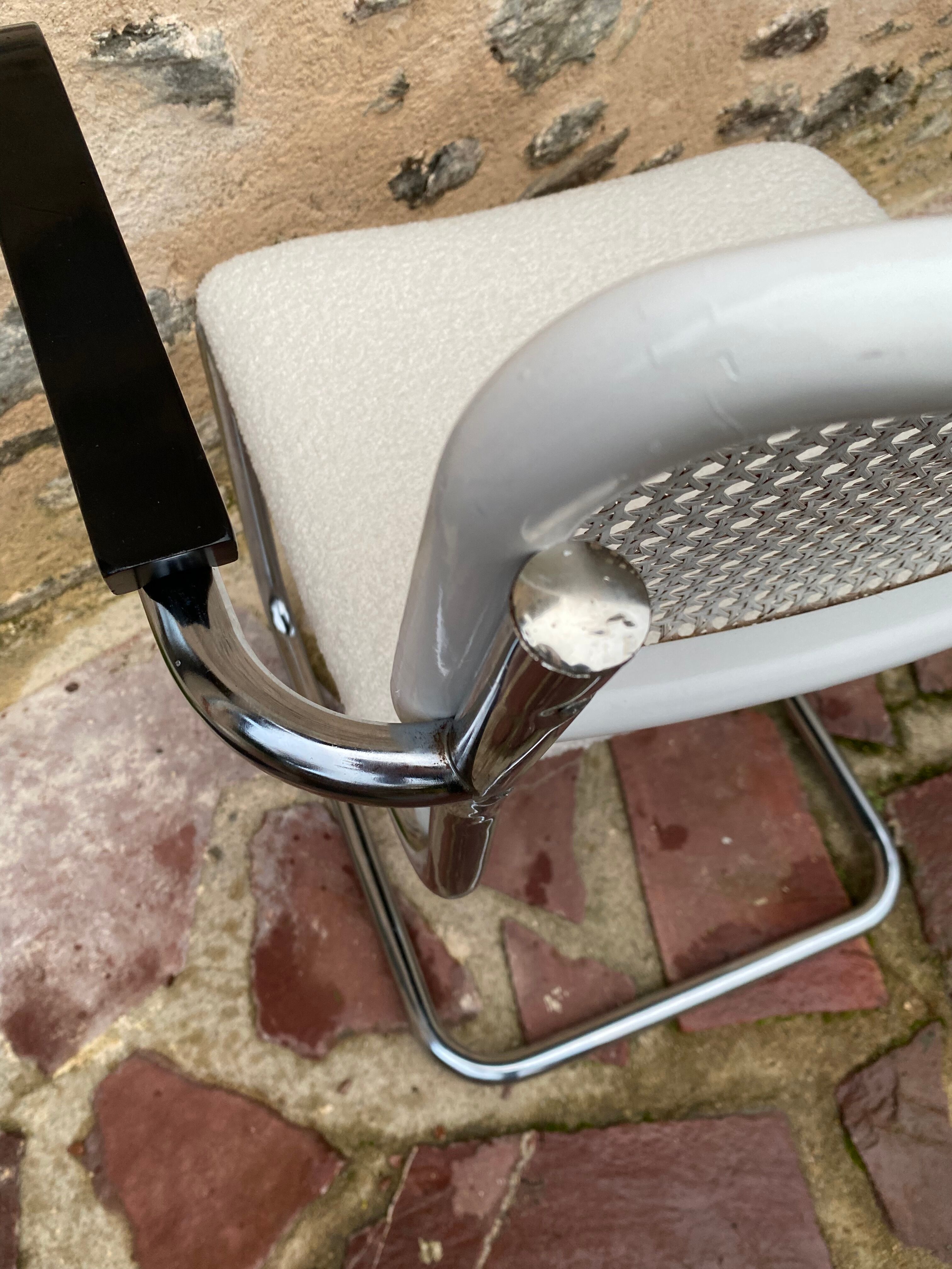 Cantilever armchair in cane and bouclette fabric