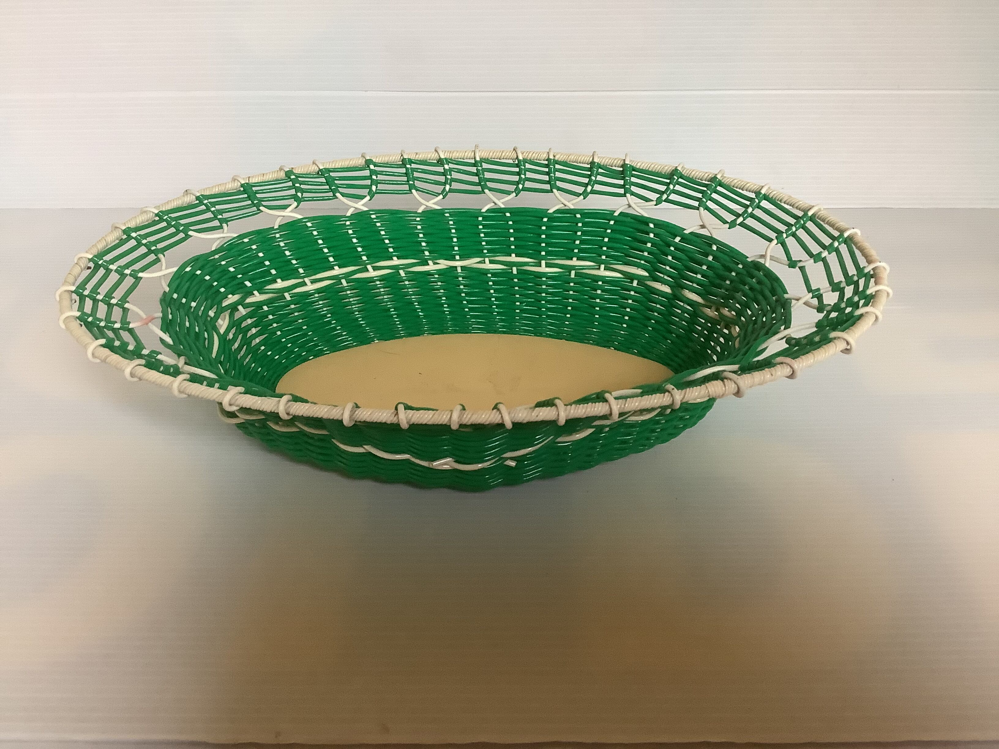 Old green scoubidou basket