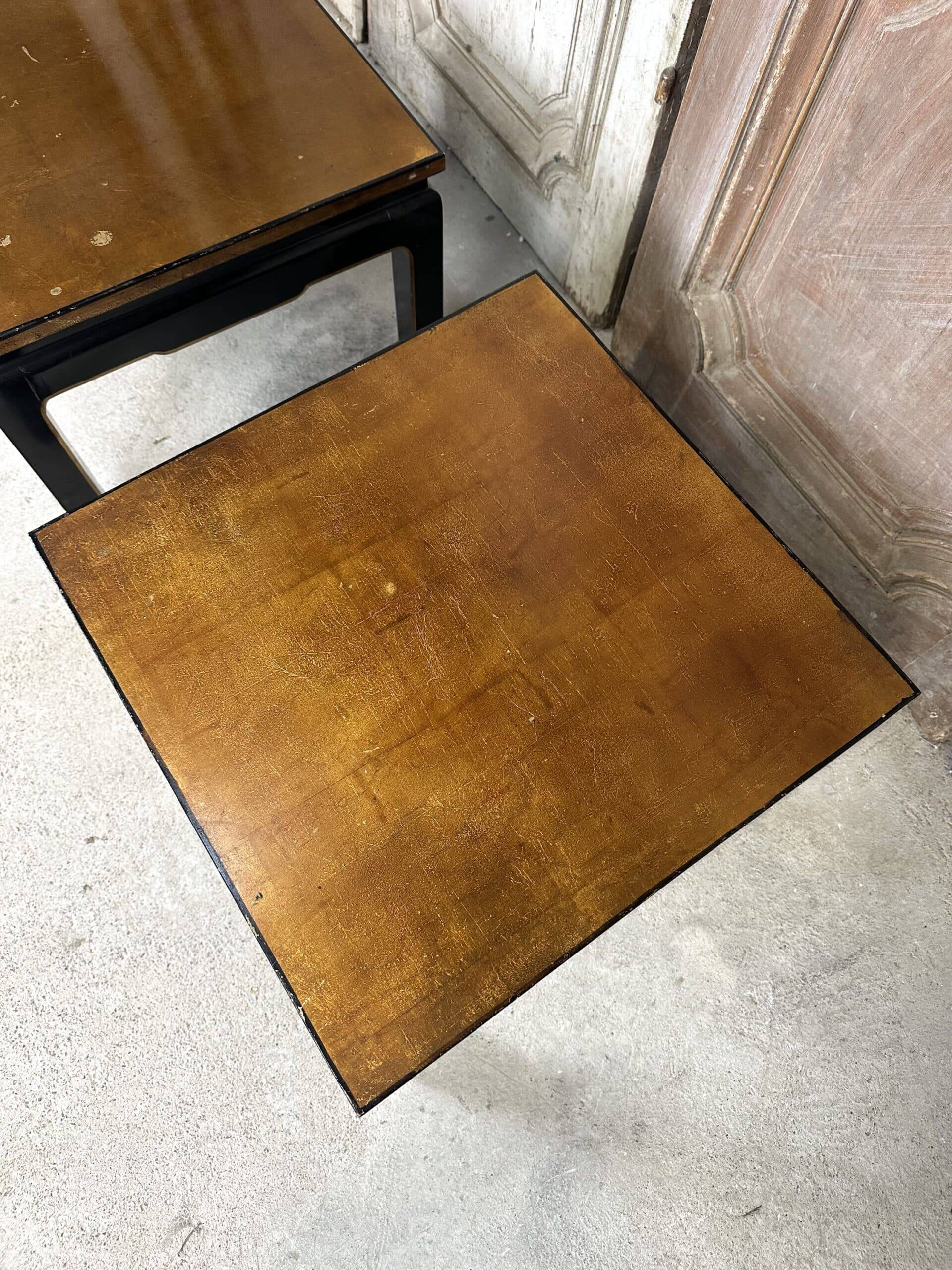 Pair of side tables in black and gold lacquer