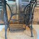 Vintage wooden table with a cast iron base.