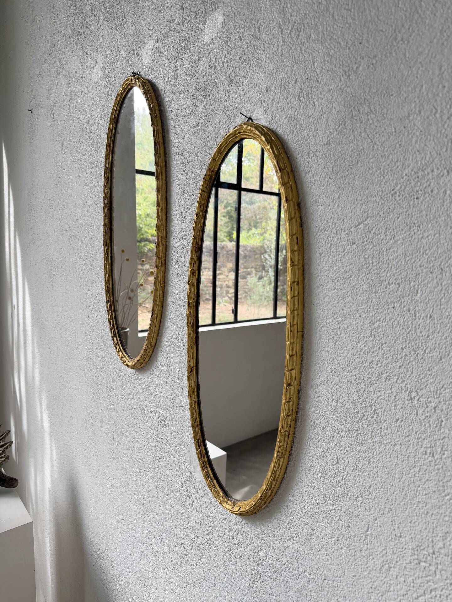 Pair of oval mirrors 1900 gilded stucco