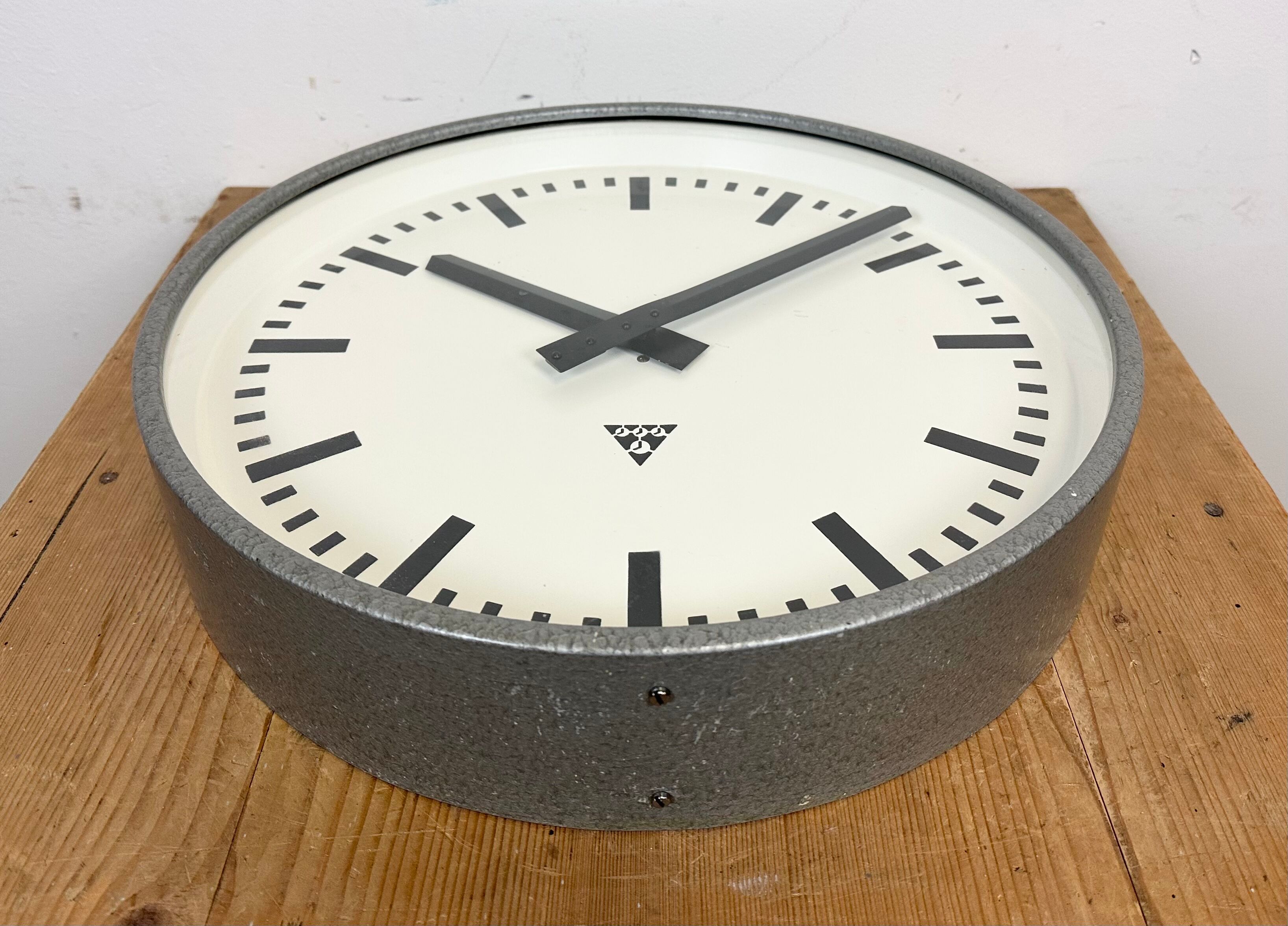 Grey industrial factory wall clock from pragotron, 1960s