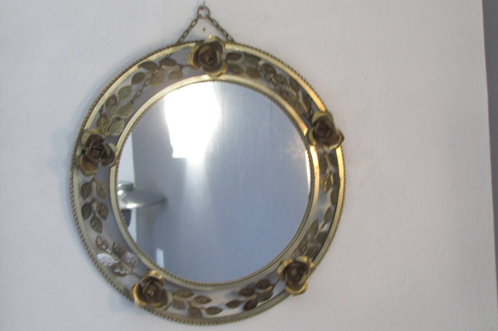 Round gold metal mirror, rose crown