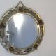 Round gold metal mirror, rose crown