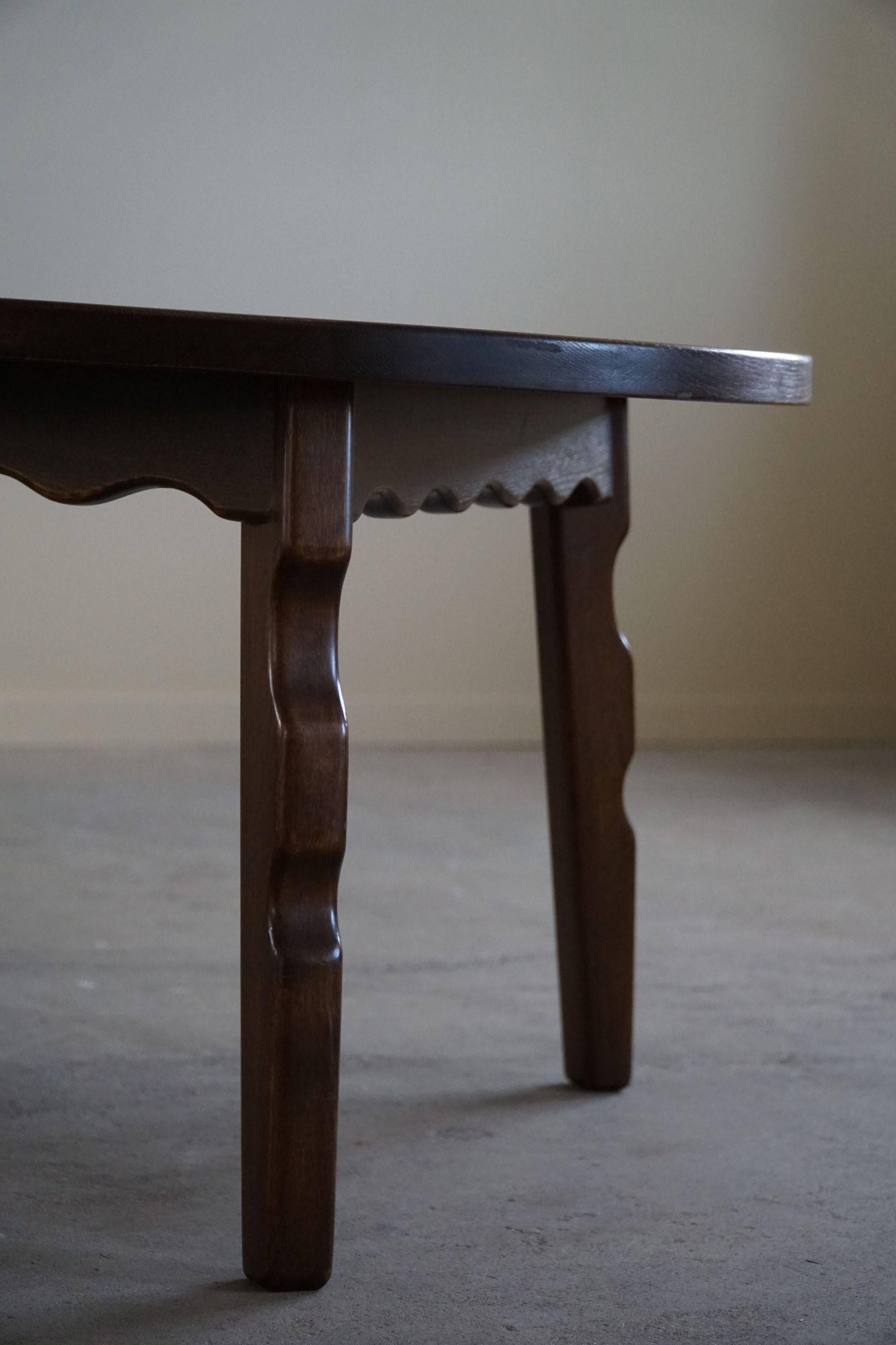 Mid-century modern round Danish side table in solid stained oak, 1960s.