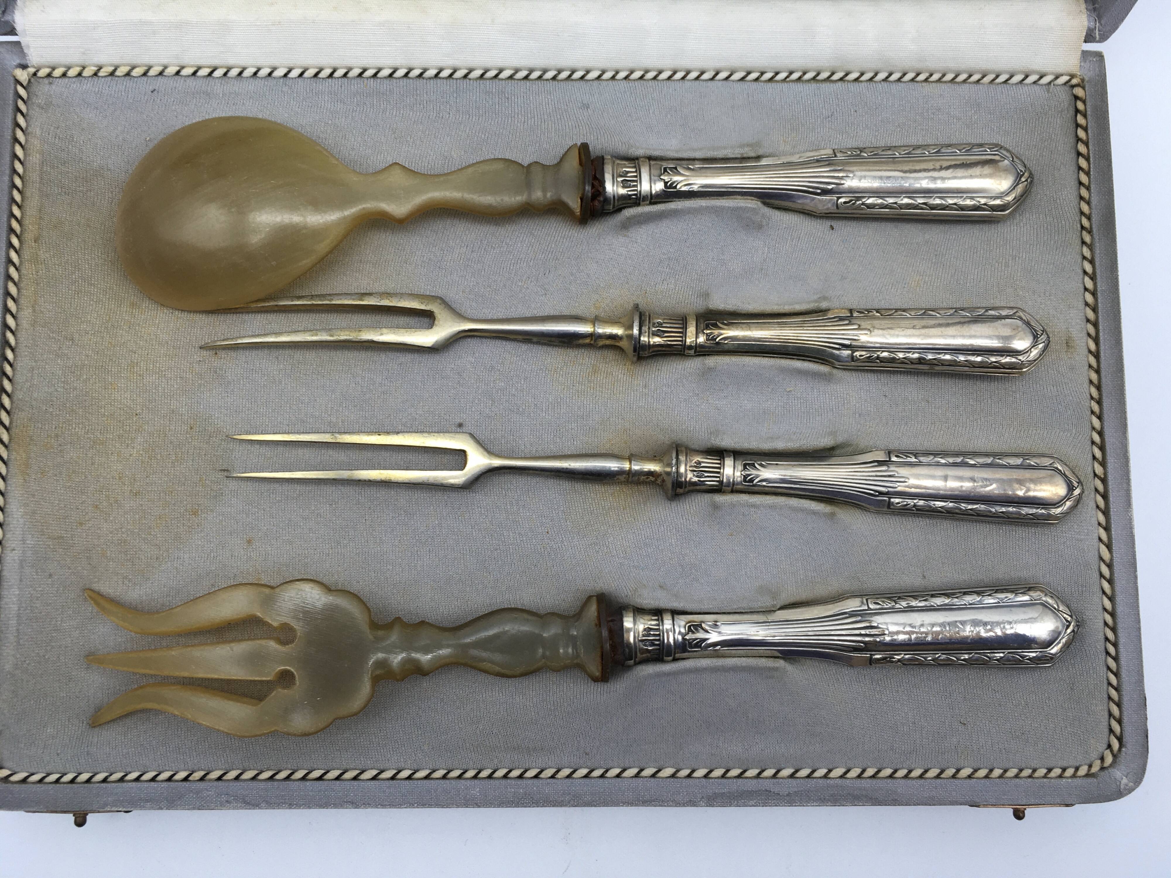 Box of filled silver salad cutlery