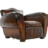 Club armchair and leather ottoman